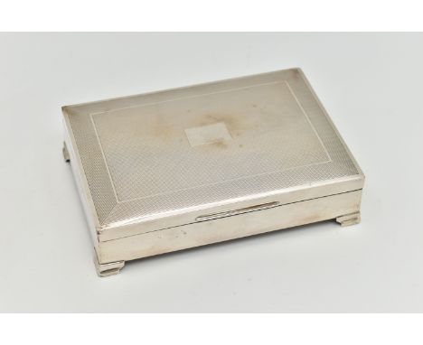 AN ELIZABETH II SILVER CIGARETTE BOX, rectangular engine turned pattern box with vacant cartouche, raised on four step feet, 