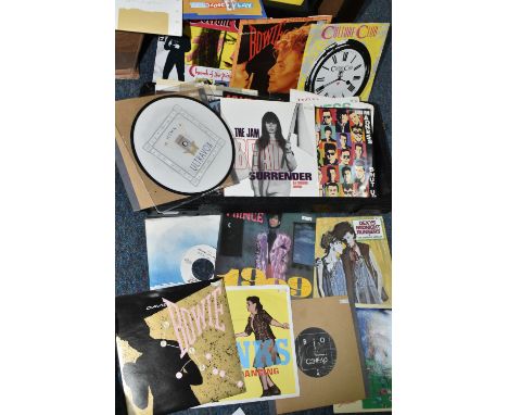 A CASE OF SINGLES AND A BOX OF CDS, to include just under two hundred singles by artists including Prince, The Police, Queen,