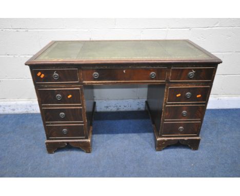 A 20TH CENTURY MAHOGANY TWIN PEDESTAL DESK, with green tooled leather writing surface, fitted with eight drawers, on bracket 