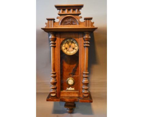A Mahogany Vienna Type Wall Clock, the enamel dial with Roman numerals and two train movement
