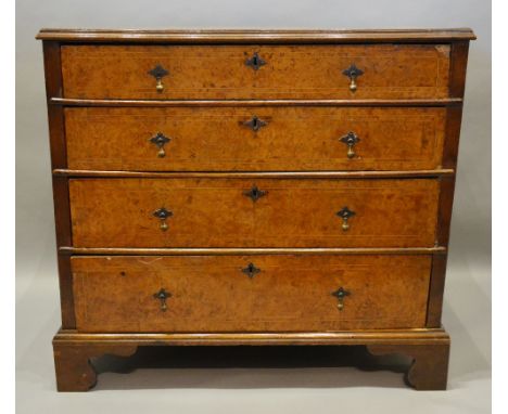 A George II Burr Walnut and Oak Chest, the moulded top above four long graduated drawers with brass drop handles and escutche