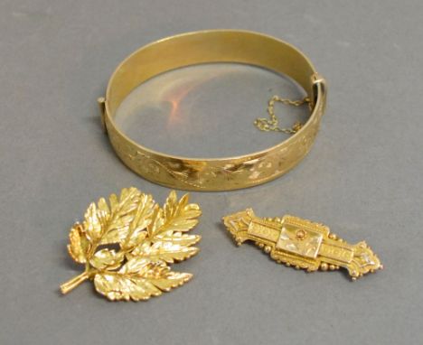 A 15ct. Gold Bar Brooch together with a rolled gold bangle and a brooch in the form of a leaf