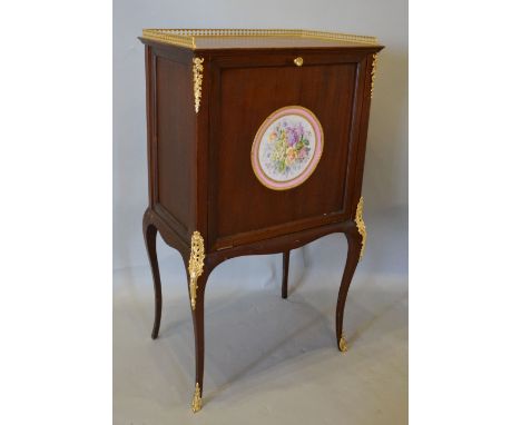 A French Gilt Metal Mounted Side Cabinet with a bass galleried top above a fall front with circular porcelain panel hand pain