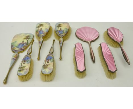 Art Deco five piece dressing table set, the enamelled backs depicting a girl in a garden scene and a four piece silver and en