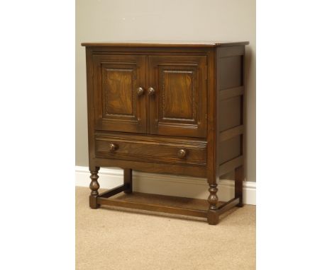 Ercol elm two door cabinet with drawer, turned supports, W80cm, H88cm, D43cm   Condition Report   Click here for further imag