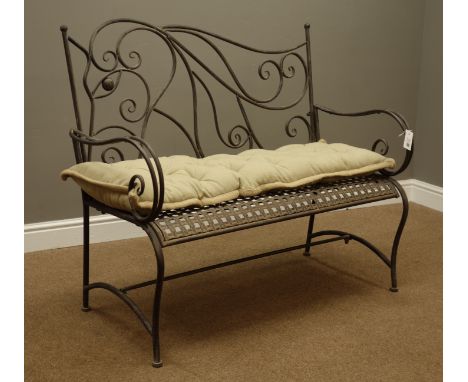 Antique finish metal garden bench with scroll work back and arms, upholstered seat cushion, W112cm   Condition Report   Click