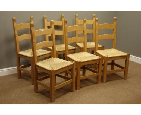 Set six beech ladder back farmhouse style dining chairs with rush seats and an oak drop leaf dining table on turned supports 