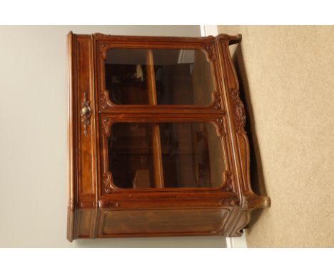 19th century French rosewood bookcase, rectangular moulded top above fitted frieze drawer, two glazed doors, fitted with adju