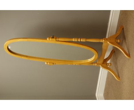 Light wood cheval dressing mirror, oval plate on turned supports, H144cm   Condition Report   Click here for further images, 