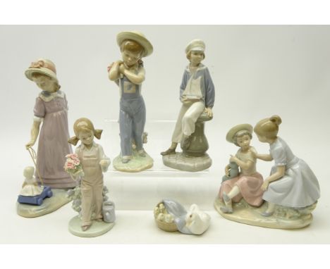 Five Lladro figures, 'Ducklings' No 4895, 'Boy with Yacht' No. 4810, 'Flower Harvest' No. 1286, 'Spring Girl' No. 5217, 'Girl