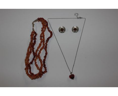 A three strand natural amber necklace with Sterling silver clasp; and amber heart shaped necklace and pair of silver Celtic s
