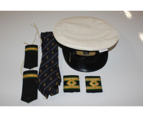 A Royal Naval Officers hat with epaulettes and tie