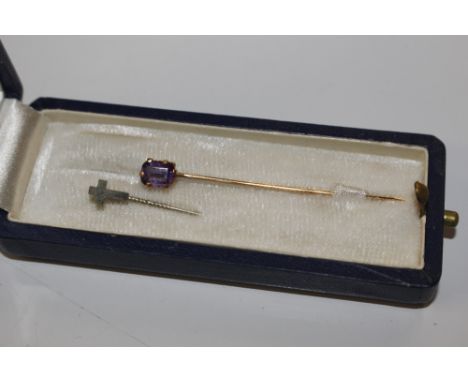 A 9ct gold amethyst set stick pin; and one other stick pin