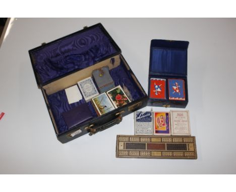 A leather suitcase AF and contents of cribbage board, playing cards etc.