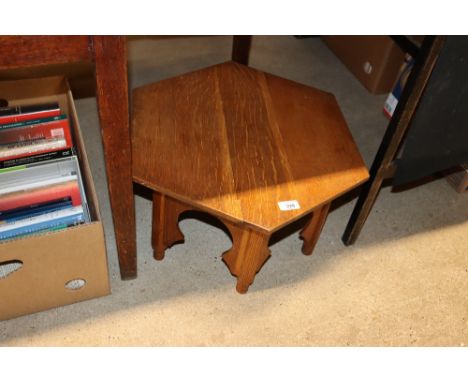 A light oak octagonal Eastern type occasional table