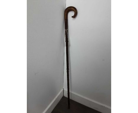 LATE VICTORIAN 'BALMORAL TWELVE DAYS OF CHRISTMAS AT CLOTHWORKERS' WALKING STICK, 1900 in pear wood, carved with national fol