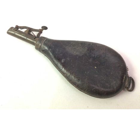 LEATHER POWDER/SHOT FLASK, ALONG WITH A COLLECTION OF MONEY BANKS the flask containing ball bearings