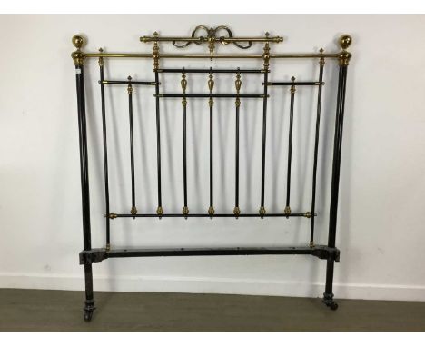 VICTORIAN CAST IRON AND BRASS BED FRAME, on ceramic castors150cm high, 138cm wide