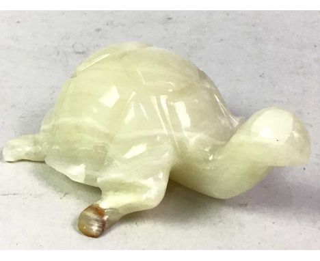 JADE ANIMAL FIGURE, 20TH CENTURY possibly Chinese, modelled as a tortoise with brown and orange inclusions11cm long