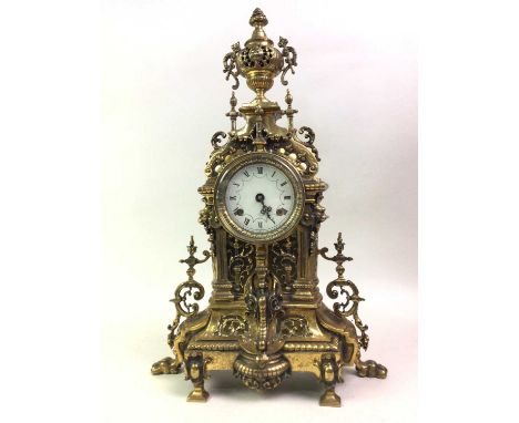 GILT METAL MANTEL CLOCK, OF ROCOCO DESIGN the circular dial with eight day movement52cm highThe clock appears to be in good c