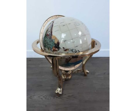 LARGE TERRESTRIAL GLOBE, fixed to a brass frame, on raised ball and claw feet43cm high