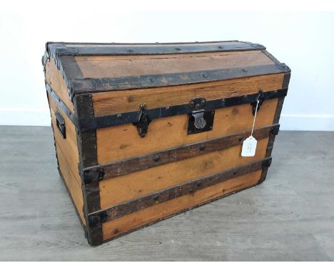 DOMED TOP TRUNK, 20TH CENTURY twin handled and wood bound with metal studs49cm high