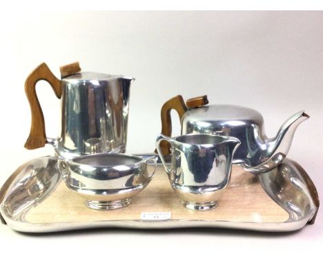 PICQUOT WARE FIVE PIECE TEA SERVICE, comprising teapot, water pot, sugar bowl and cream jug, along with three glass paperweig