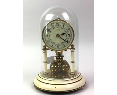 PACO ANNIVERSARY CLOCK, AND ANOTHER CLOCK  the anniversary clock under a glass dome, the other a walnut cased mantel clock21c