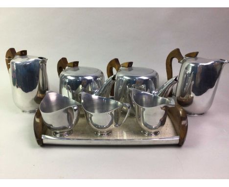 PICQUOT WARE TEA AND COFFEE SERVICE, comprising two teapots, two coffee pots, two sugar bowls, cream jug and tray