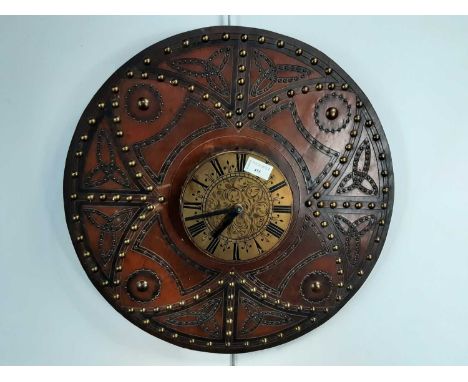 REPRODUCTION TARGE LEATHER CELTIC SHIELD, 20TH CENTURY converted to a clock51.5cm wide