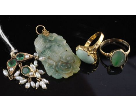 Three items of gold and jade jewellery including two rings and a carved pendant, together with an 18ct gold, emerald and diam