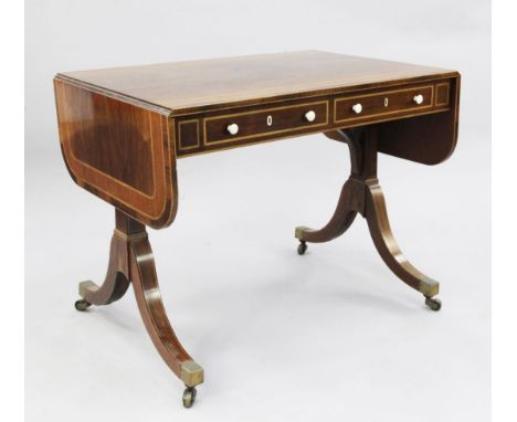 A George III mahogany sofa table, with satinwood and ebony line inlays, two drawers opposing two dummy drawers, on trestle en