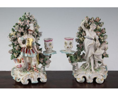 A pair of Derby candlestick groups, c.1770, modelled as Mars and a cockerel and Venus and Cupid standing before bocage, with 