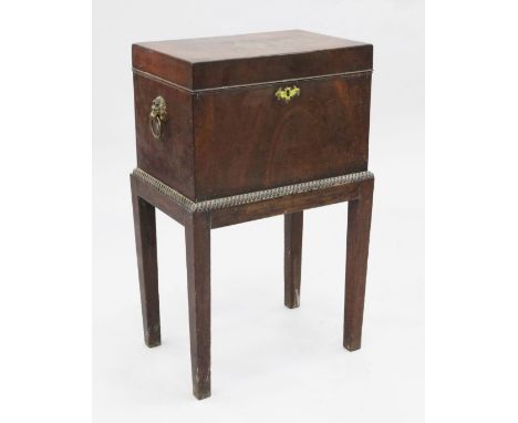 A 19th century mahogany rectangular cellaret, with lion mask ring handles and ropetwist handles, on square section tapering s