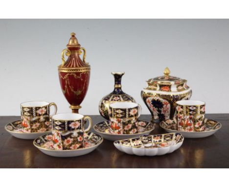 A group of Royal Crown Derby Imari wares and a similar scarlet ground gilt decorated two handled vase & cover, early 20th cen