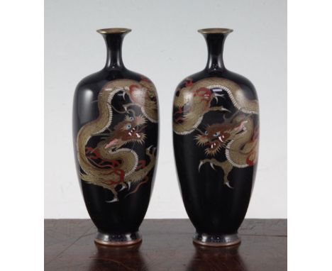 A pair of Japanese silver wire cloisonne enamel 'dragon' vases, Meiji period, each decorated with a three claw dragon on a mi