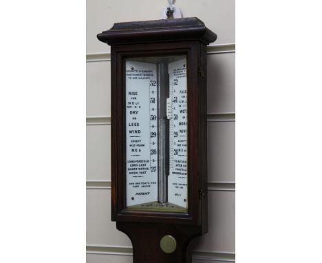 A late Victorian Negretti and Zambra oak stick barometer, with ceramic scale and thermometer, 3ft 4in.