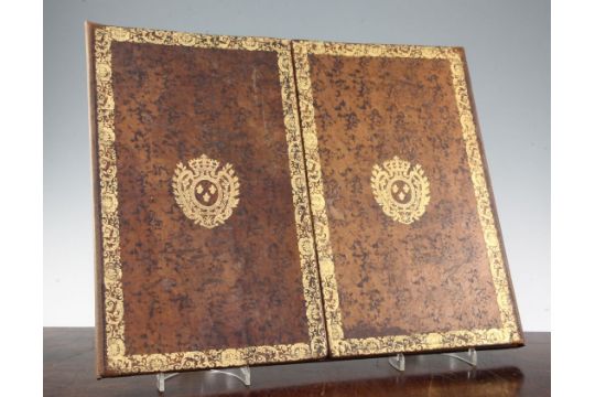 A French Gilt Tooled And Brown Leather Double Folding Desk Blotter