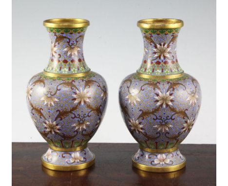 A pair of Chinese cloisonne enamel baluster vases, early 20th century, each with gilded bands and wires, decorated with lotus