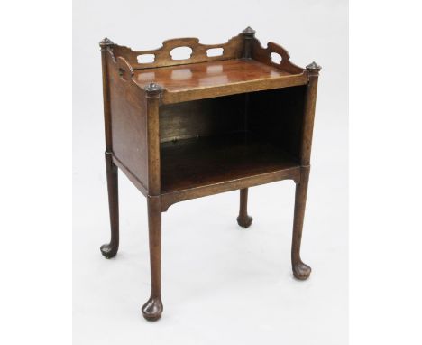 A George III mahogany bedside commode, with pierced three quarter gallery top above open space, on tapering supports and pad 