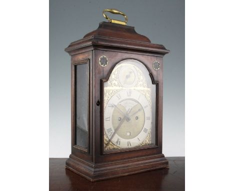 A George III mahogany bracket clock, with plain case and arched brass dial, inset with silvered strike / silent, later numera