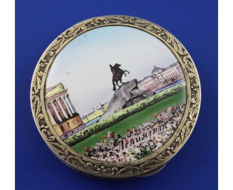 A 20th century Latvian 875 standard silver gilt and enamel circular compact, the lid decorated with scene of Leningrad, (name
