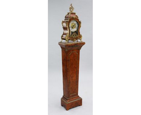 A Louis XVI style ormolu mounted burr wood mantel clock and pedestal, with tablet numerals and German movement, overall heigh