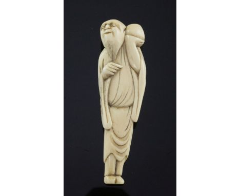 A Japanese ivory netsuke of a man holding a peach aloft, Edo period, c.1780, unsigned, 7.5cm