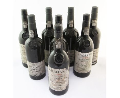 Eight assorted vintage ports including four Taylor 1985, and four Graham 1983; cellar-soiled labels.