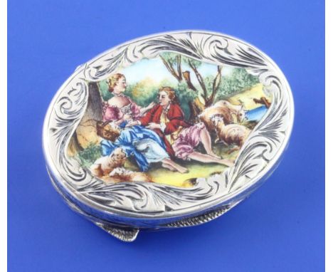 A late 19th/early 20th century Italian 800 standard silver and enamel oval pill box, box with chased scroll decoration and li