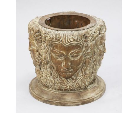 An unusual Continental carved limewood basket or planter, carved with Green Man faces, on circular base, W.1ft 6in.