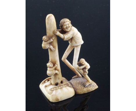 A Japanese ivory netsuke of Ashinaga holding the nose of a Tengu mask, Edo period, with two children climbing the nose of the