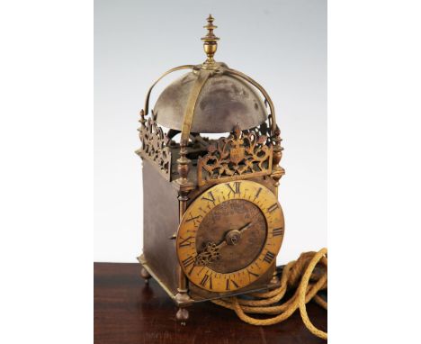 An early 20th century 17th century style brass lantern clock, with oak bracket, 15.5in.