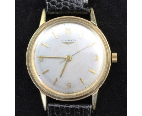 A gentleman's early 1960's 9ct gold Longines manual wind wrist watch, the silvered dial with baton and quarterly Arabic numer